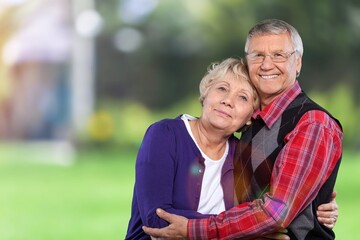 Happy senior couple have together in a garden