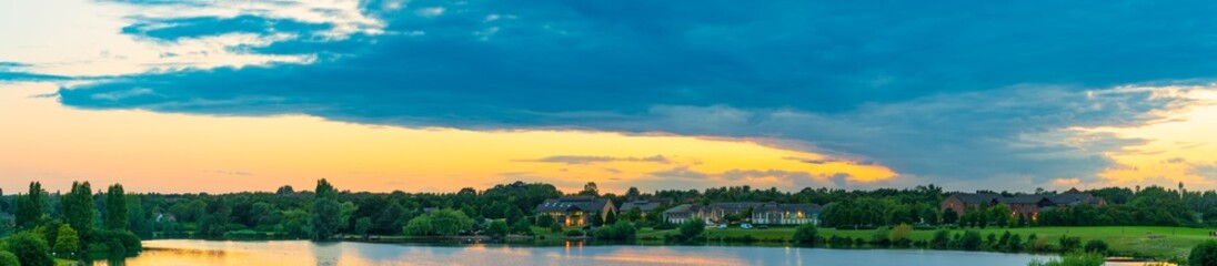 Furzton lake panorama at sunset in Milton Keynes. England	
