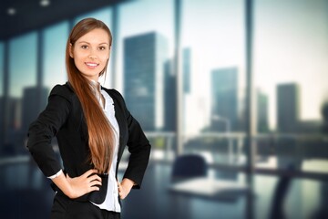 Happy young business woman employee posing