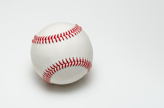 Closeup of a baseball ball with red stitches