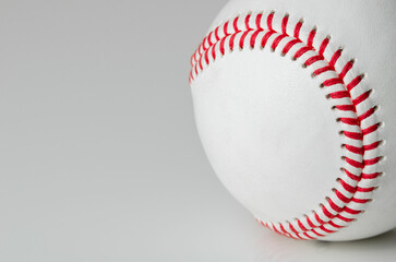 Closeup of a baseball ball with red stitches