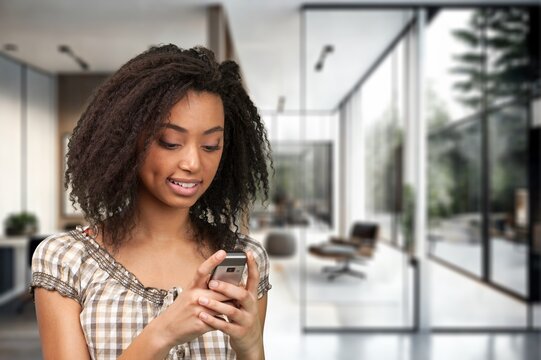 Young happy businesswoman using smartphone, AI generated image