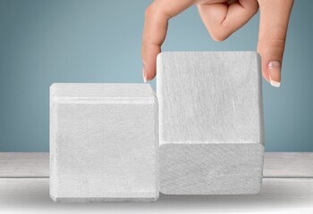UX and UI concept. The wooden cube on desk