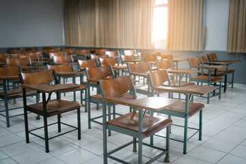 Empty classroom with vintage tone wooden chairs. Back to school concept