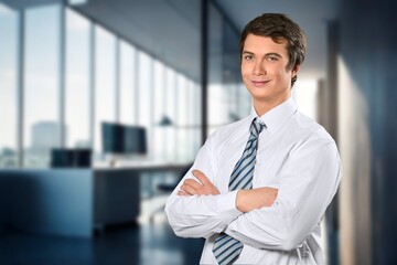Fototapeta premium Handsome young businessman works in office