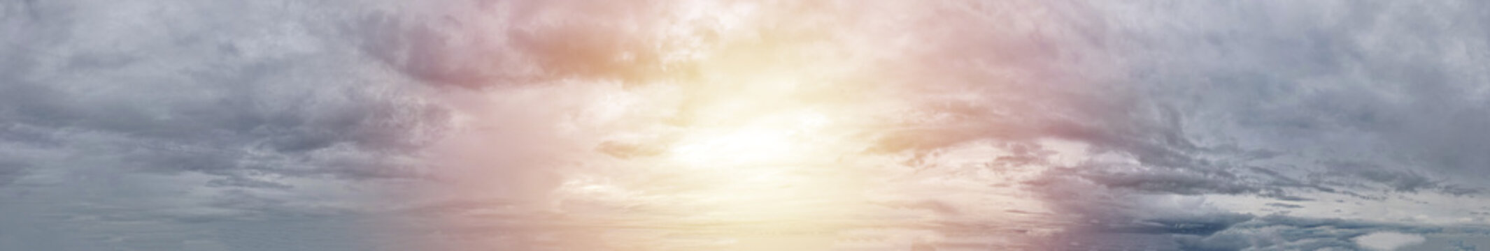 Graceful grey sky with bright orange sunlight offers a mesmerizing display of nature's artistry and beauty.