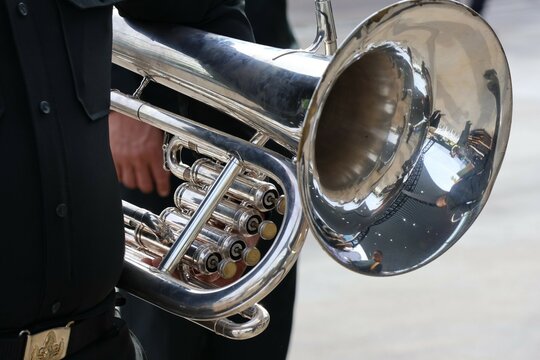 Male musician Holding a euphonium instrument Outdoor Playing music