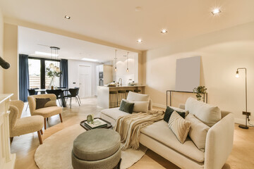 a living room with couches, chairs and a coffee table in the center of the room is very clean