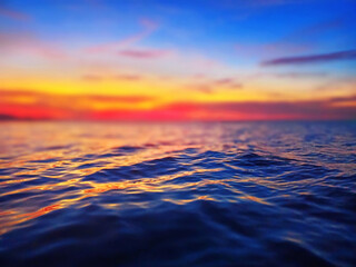 Sea sunset soft blurred background, ocean sunrise, tropical island beach dawn, dark blue water...