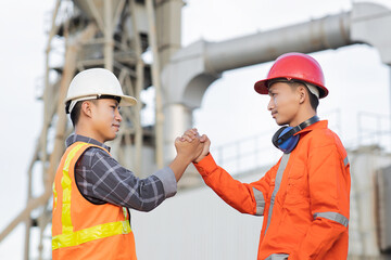 Engineer cement factory shaking hand with team and cooperation concept after finish agreement...