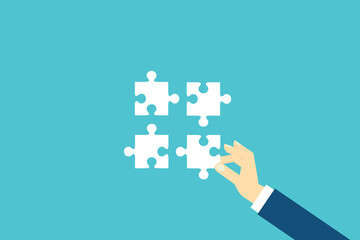Teamwork and development concept . Putting missing puzzle together.