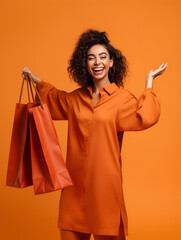 Cheerful happy woman enjoying shopping carrying shopping bags on colorful background