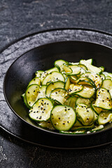 Sunomono, Japanese Cucumber Salad in a black bowl