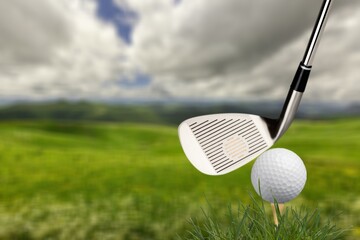 Golf balls on the green course with clubs, sport concept.