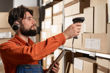 Warehouse manager with barcode reader and tablet PC. Inventory control.