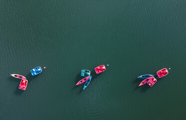 Aerial drone photo of moored pedalo with kayak on the lake 