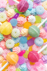Fototapeta na wymiar Sweet lollipops and candies on white background