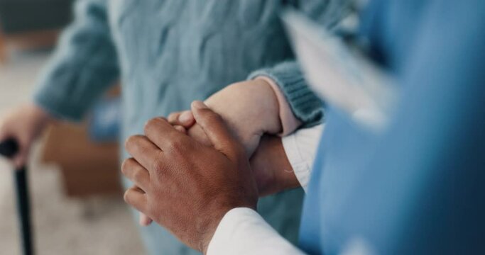 Senior patient, nurse and holding hands for support at a nursing home in retirement. Closeup of elderly person with a caregiver for advice, empathy and kindness or help with healthcare or homecare