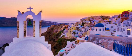 Sunset at the Greek village of Oia Santorini Greece with a view over the ocean caldera of Santorini - obrazy, fototapety, plakaty