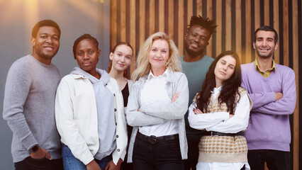 Business team consisting of young business people standing side by side