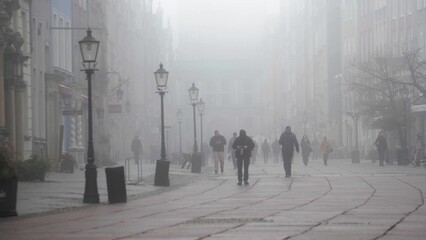 Anonymous People Walking Old Town Streets on Foggy Morning, Gdansk Poland