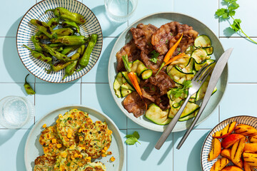 Summer dinner, Grilled meat and vegetables.Top view,Tile background.