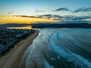 Fototapeta na wymiar Sunrise at the seaside with gentle surf