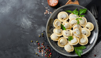 Traditional russian pelmeni, ravioli, dumplings with meat on black concrete background. Parsley, quail eggs, pepper, rosemary, bay leaf and spices. Top view. Copyspace - Powered by Adobe