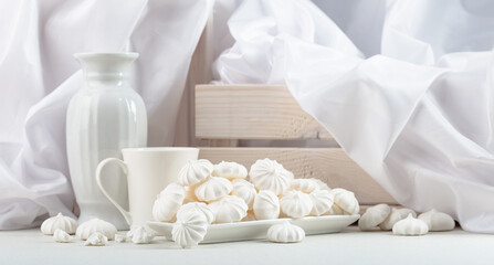 Fototapeta na wymiar Small white meringues.