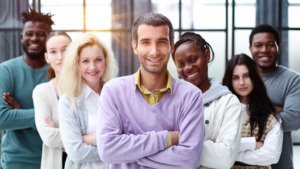 Group of business people standing at the window of a modern office