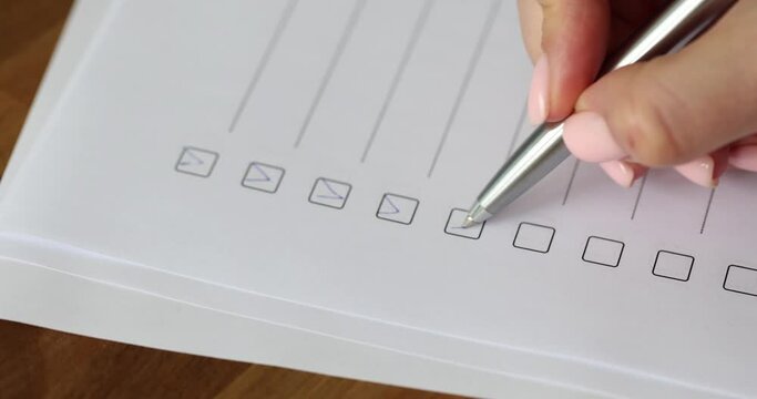 Hand will mark answer with tick in test. Passing questionnaire concept