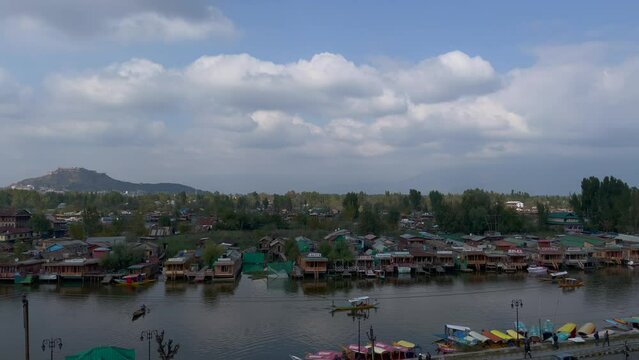 View Dal Lake in summer, and the beautiful mountain range in the background in the city of Srinagar, Kashmir, India.