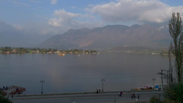 View of Dal Lake during summer, and the beautiful mountain range in the background in the city of Srinagar, Kashmir, India.