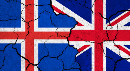 Fototapeta premium Flags of Iceland and United Kingdom on cracked surface - politics, relationship concept