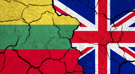 Fototapeta premium Flags of Lithuania and United Kingdom on cracked surface - politics, relationship concept