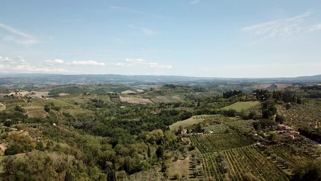 Stunning green fields of Tuscany, Italy. Drone view of the olive plantations, Tuscany roads and fields