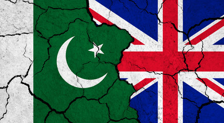 Fototapeta premium Flags of Pakistan and United Kingdom on cracked surface - politics, relationship concept