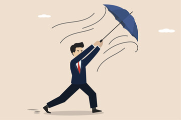 Fototapeta na wymiar Business people hold work problems, business people face problems. Businessman holding his own umbrella which was blown by strong wind.