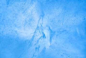 Blue ice texture with cracks, close-up, macro.