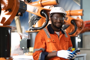 Multiracial engineer working with robot automation maintenance technology in factory, portrait....