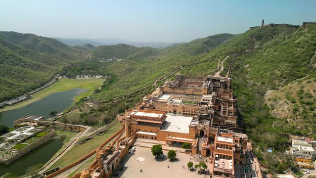 Jaipur, India: Aerial view of iconic fort Amber Palace, built from sandstone and marble - landscape panorama of South Asia from above
