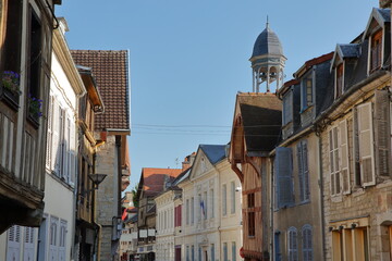 The main commercial street (Gd rue de la Resistance) in Bar sur Seine, Aube, Grand Est, champagne ardenne, France, with the Town Hall and ancient colorful half-timbered houses