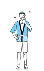 自信家のポーズを取る夏祭りの法被を着たシニア男性