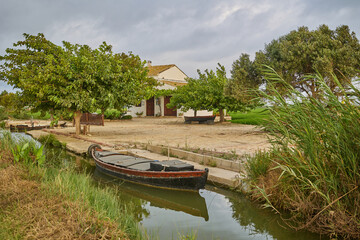 Spanish farmhouse next to the irrigation canal of Lake Albufera.