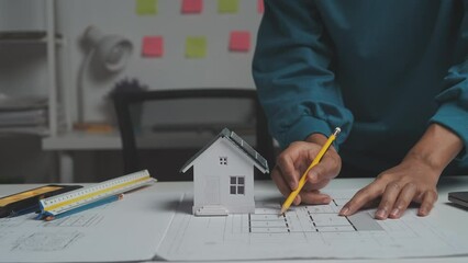 Female Industrial Engineers Look at Project Blueprints, measurements and drawing process of technical details on paper, International Labor Day Is 15 september a engineers day?