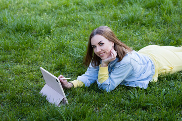 girl outdoors with a tablet in the hands