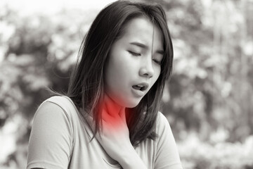 sick asian woman having sore throat; concept of sickness with coughing, hiccupping, choking, acid...
