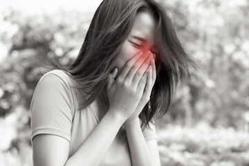 Fototapeta premium sick woman sneezing with sore throat; sick woman with allergic sneeze symptom, sore throat, cold, flu, contagious virus disease, coronavirus, allergy, health care concept; young asian woman model