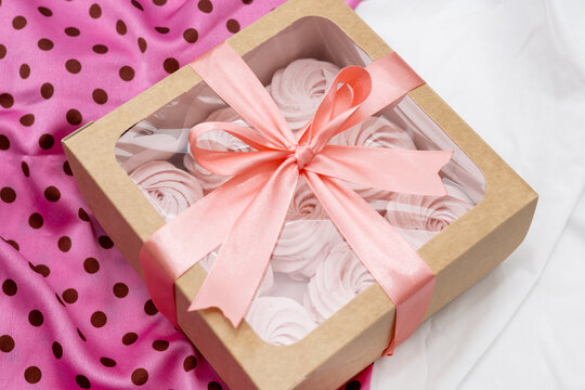 homemade marshmallow zephyr with strawberry taste on wooden boards. strawberries slice , sugar powder top view.food photography