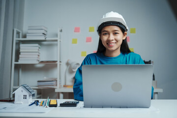 Female Industrial Engineers Look at Project Blueprints, measurements and drawing process of technical details on paper, International Labor Day Is 15 september a engineers day?
